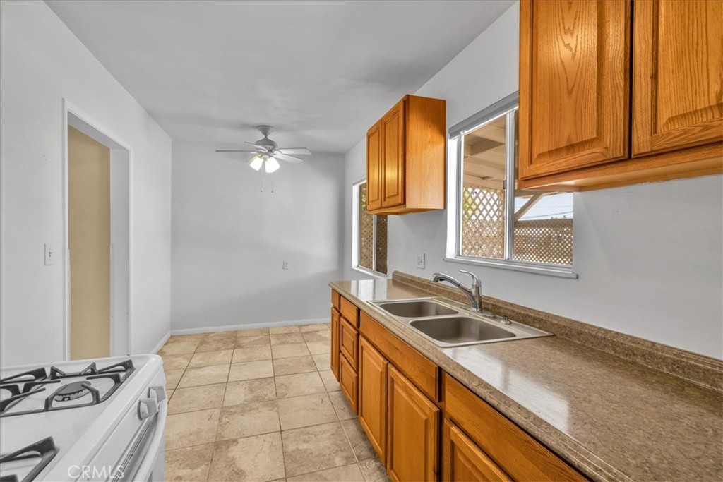 7337 Condalia Avenue Yucca Valley, CA 92284 - Photo 7 of 48 a kitchen with a sink and a window