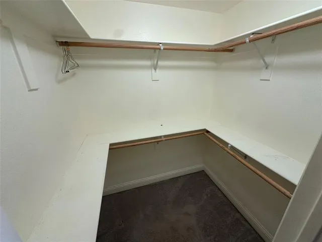 a front view of a house with a garden and yard