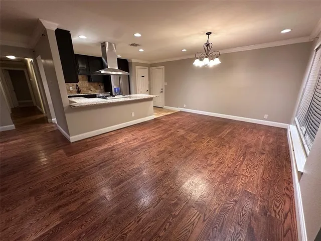 a view of kitchen with sink microwave and refrigerator