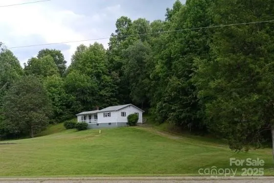 a house with trees in the background