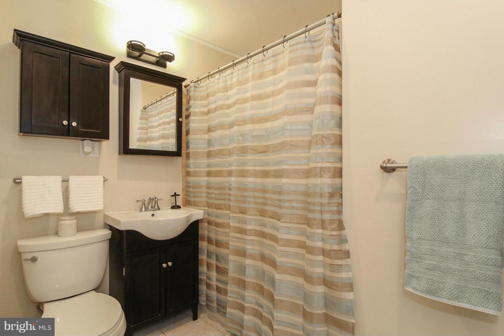 3205 Holloway Road Falls Church, VA 22042 - Photo 11 of 30 a bathroom with a toilet sink and mirror