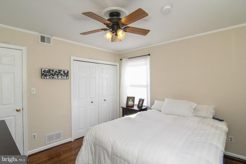 3205 Holloway Road Falls Church, VA 22042 - Photo 14 of 30 a bedroom with a bed and a ceiling fan