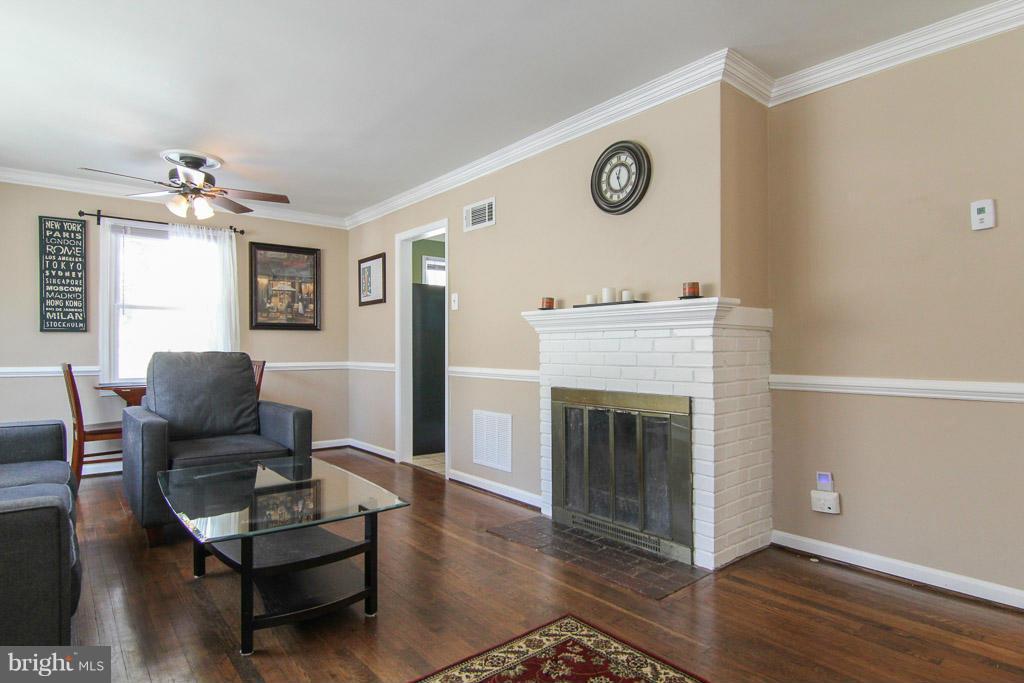 3205 Holloway Road Falls Church, VA 22042 - Photo 3 of 30 a living room with furniture and a fireplace