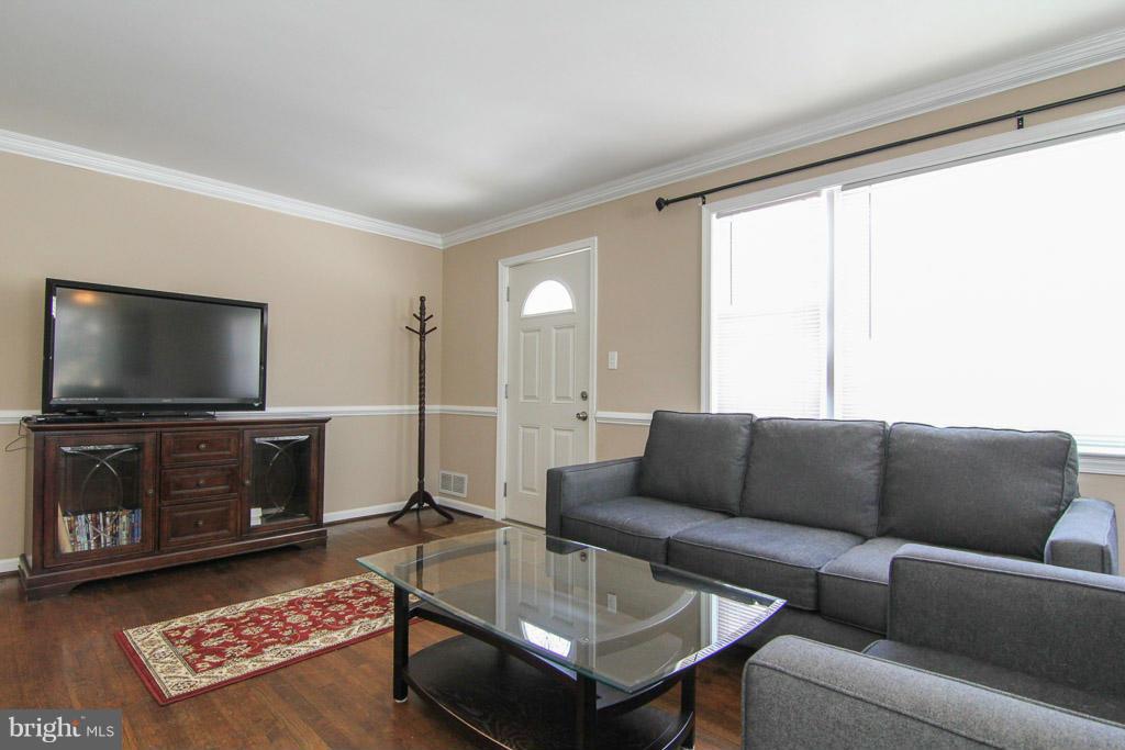 3205 Holloway Road Falls Church, VA 22042 - Photo 4 of 30 a living room with furniture and a flat screen tv