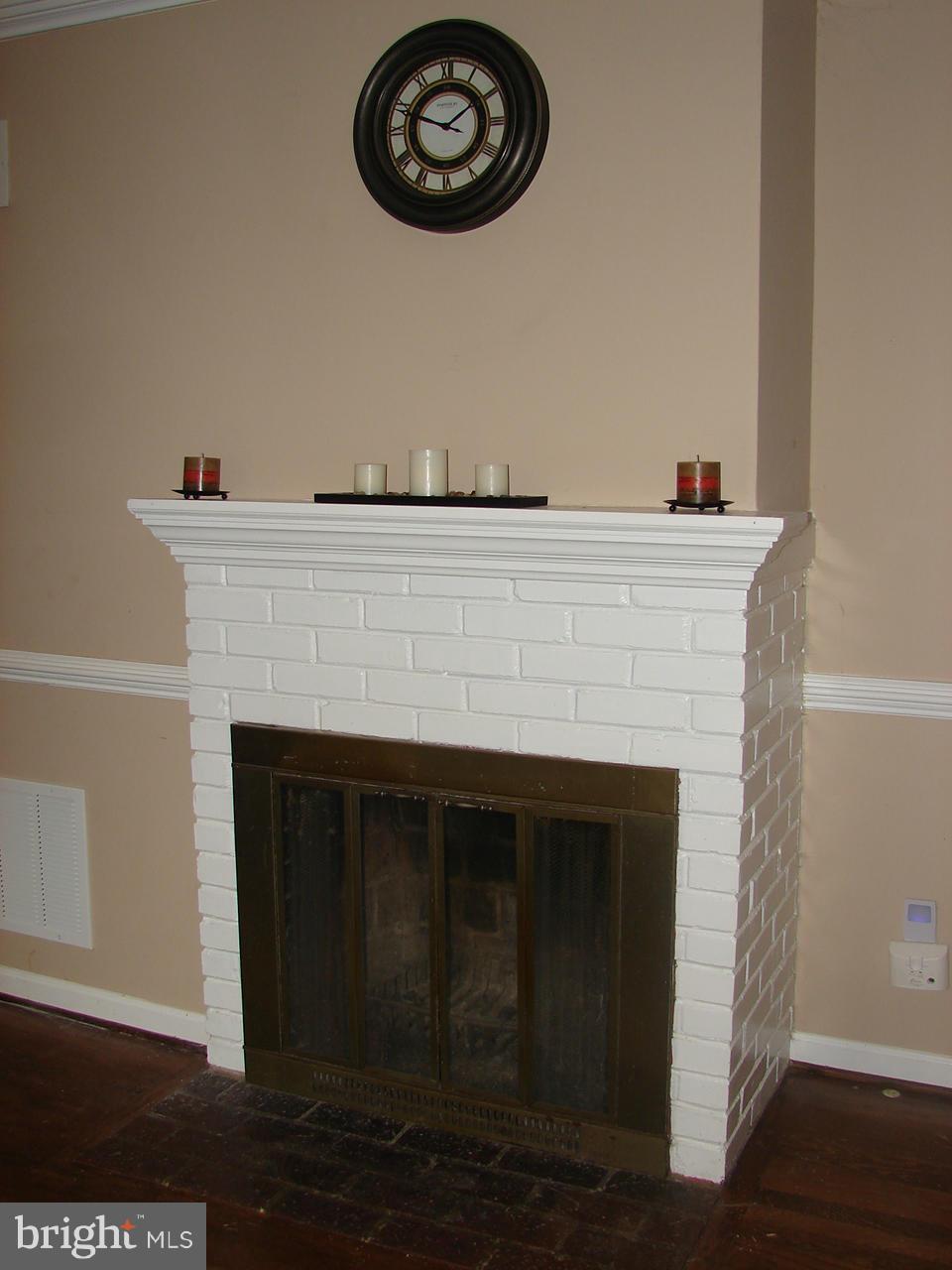 3205 Holloway Road Falls Church, VA 22042 - Photo 5 of 30 a close view of a fireplace with a wooden floor
