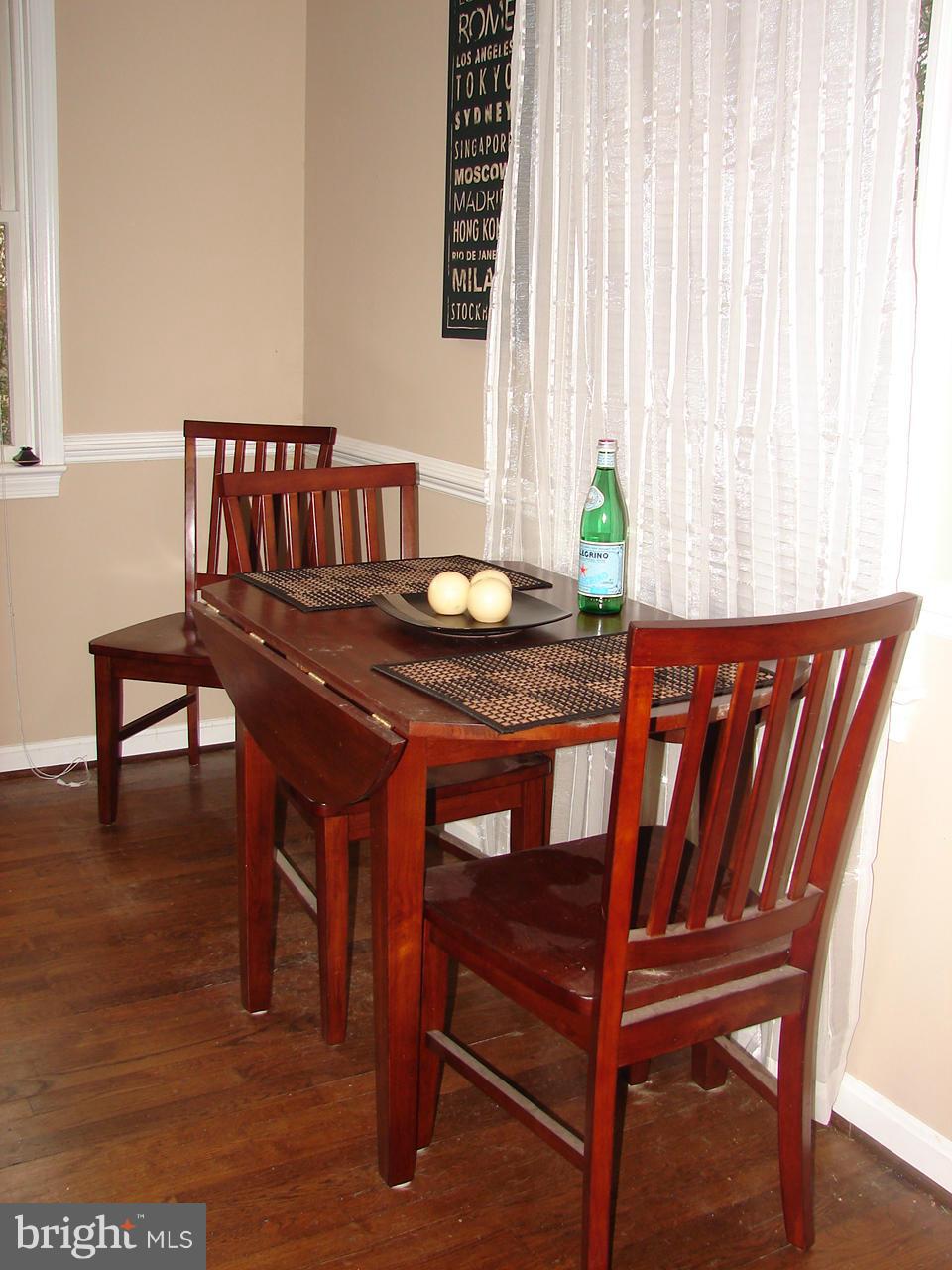 3205 Holloway Road Falls Church, VA 22042 - Photo 6 of 30 a dining room with furniture and wooden floor