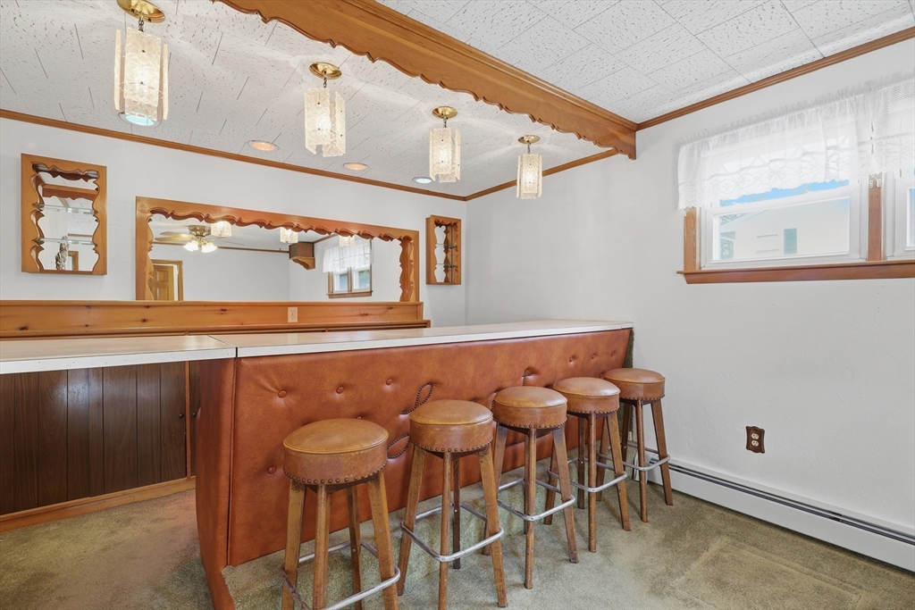 10 Deluca Road Milford, MA 01757 - Photo 18 of 37 a kitchen with a table and chairs in it