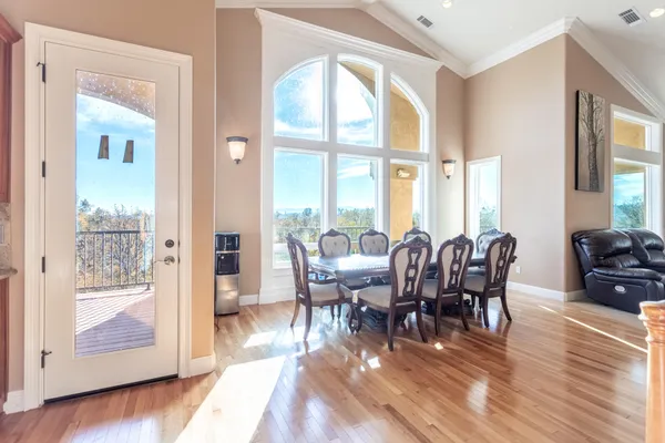 a view of a dining room with furniture window and wooden floor