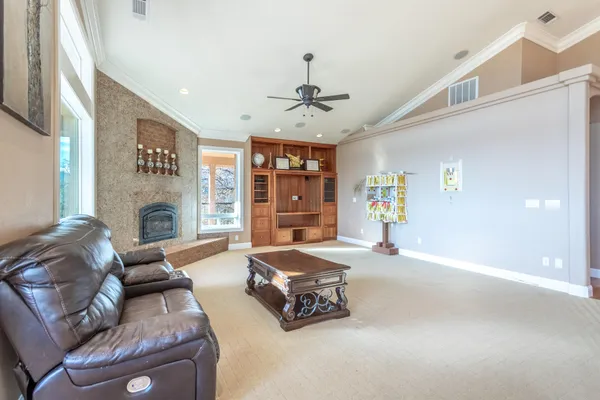 a living room with furniture and a fireplace