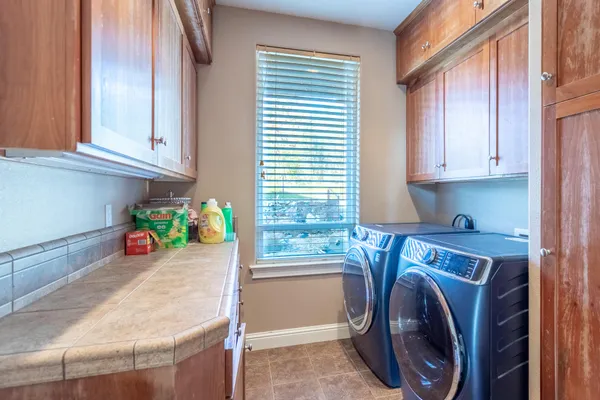 a utility room with dryer and washer