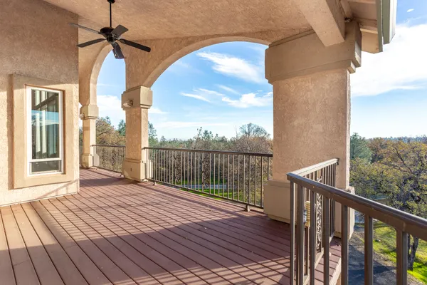 a view of balcony with wooden floor