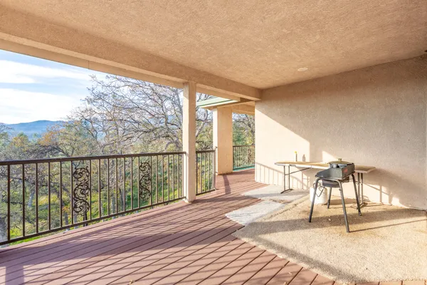 a porch with wooden floor and outdoor space