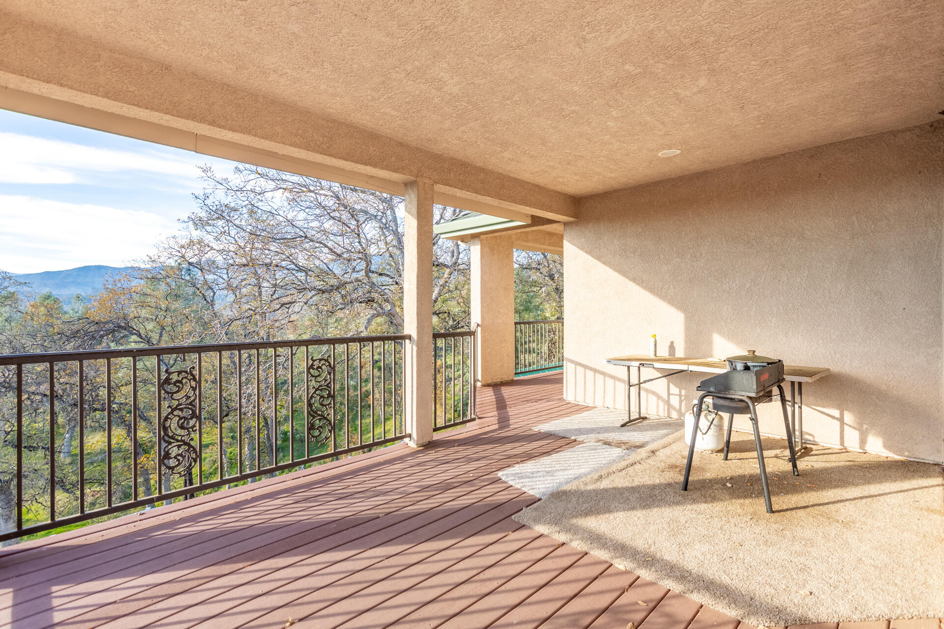7775 Muletown Road Redding, CA 96001 - Photo 35 of 45 a porch with wooden floor and outdoor space