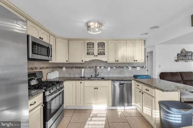 a bathroom with a sink a mirror and shower