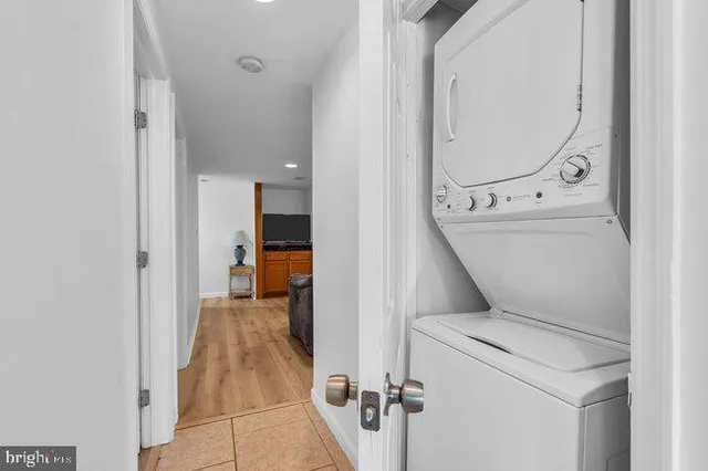 a bathroom with a sink a toilet and shower curtain