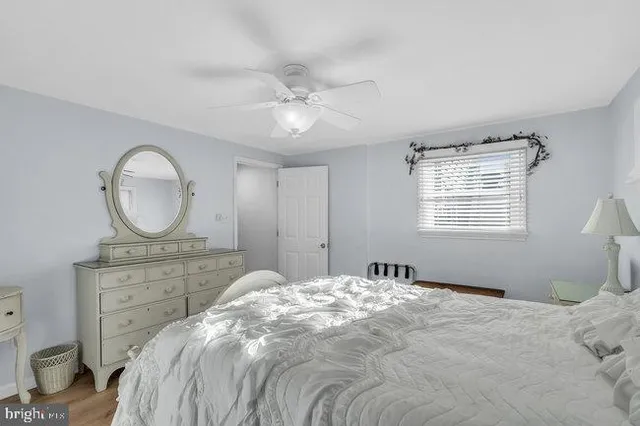 a bedroom with two beds and a window