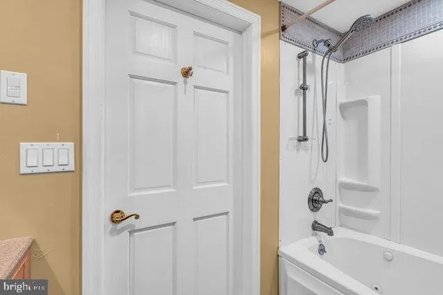 a bedroom with two beds and a night stand