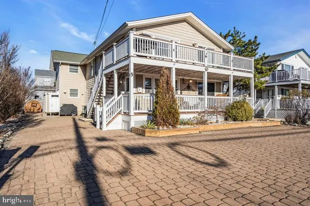 a kitchen with stainless steel appliances kitchen island granite countertop a sink and cabinets