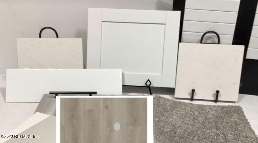 57 Cedar Elm Way St. Augustine, FL 32092 - Photo 3 of 23 a view of a faucet a sink and a refrigerator