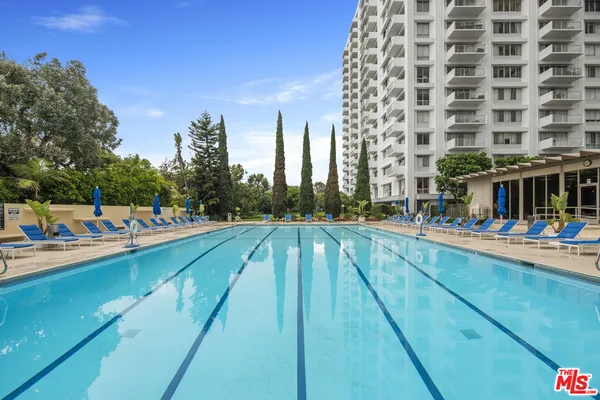 a view of swimming pool from a balcony