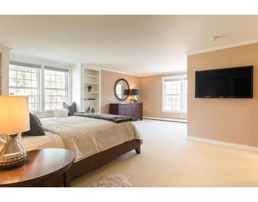 254 Old Sudbury Road Sudbury, MA 01776 - Photo 17 of 30 a bedroom with a large bed and a flat tv screen on dresser