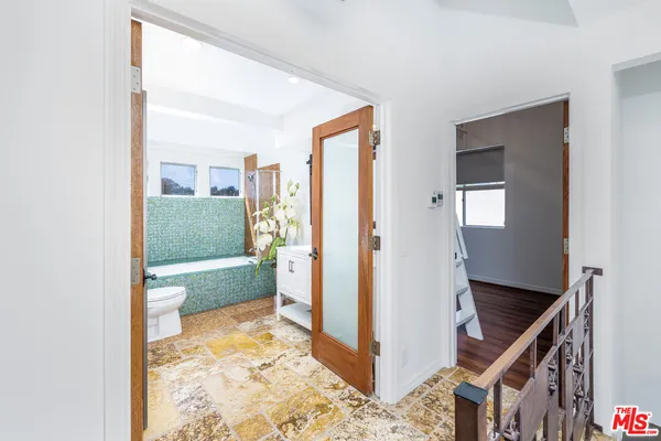 a bathroom with a bathtub sink and toilet