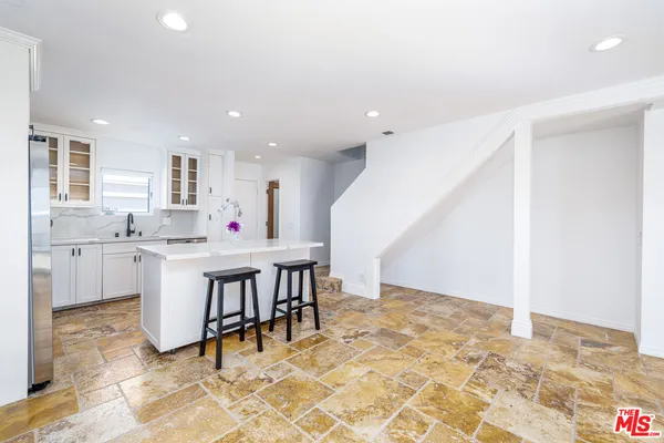 a view of a kitchen and dining room