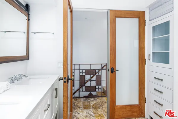 a bathroom with a sink and a mirror
