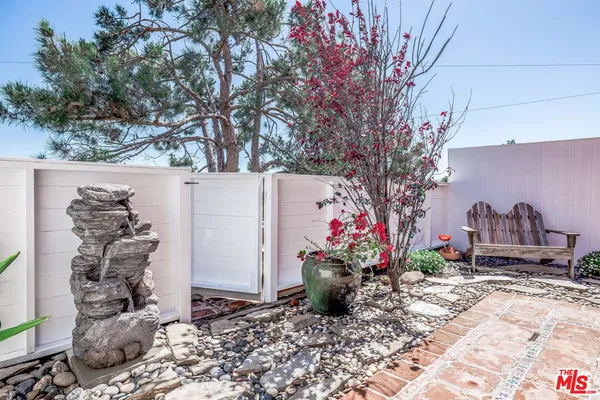 a view of a potted plants in middle of the house