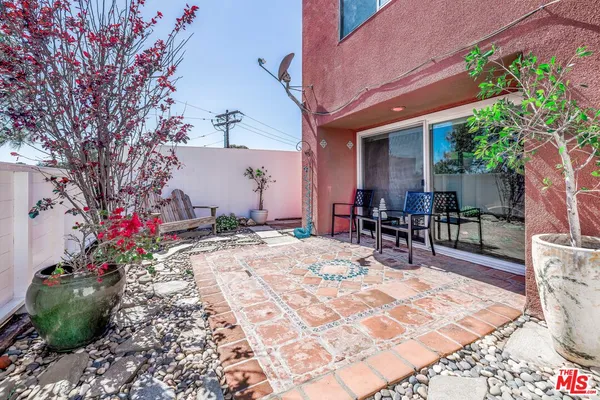 a view of a backyard with sitting area