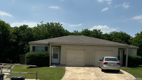 a house view with a garden space