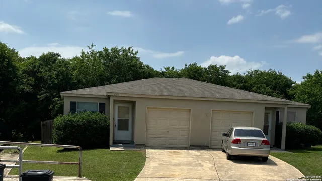 a house view with a garden space