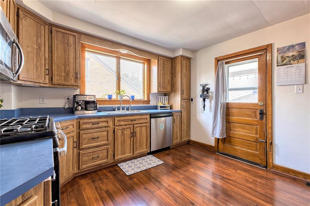 155 Lenox Street Uniontown, PA 15401 - Photo 12 of 32 a kitchen with sink cabinets and wooden floor