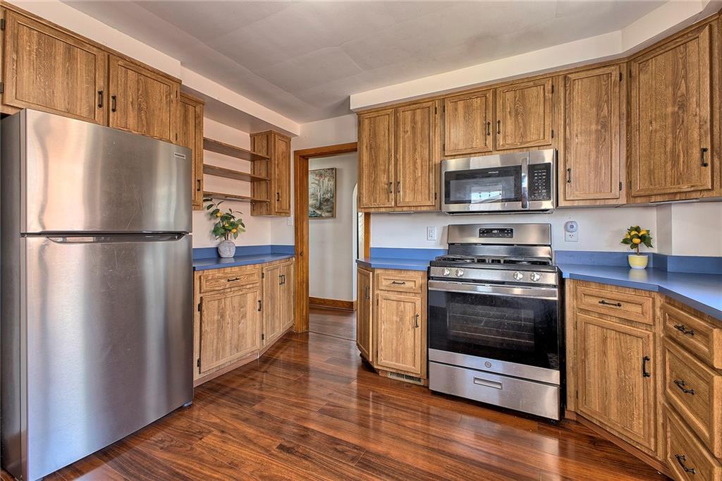 155 Lenox Street Uniontown, PA 15401 - Photo 13 of 32 a kitchen with a refrigerator stove and microwave