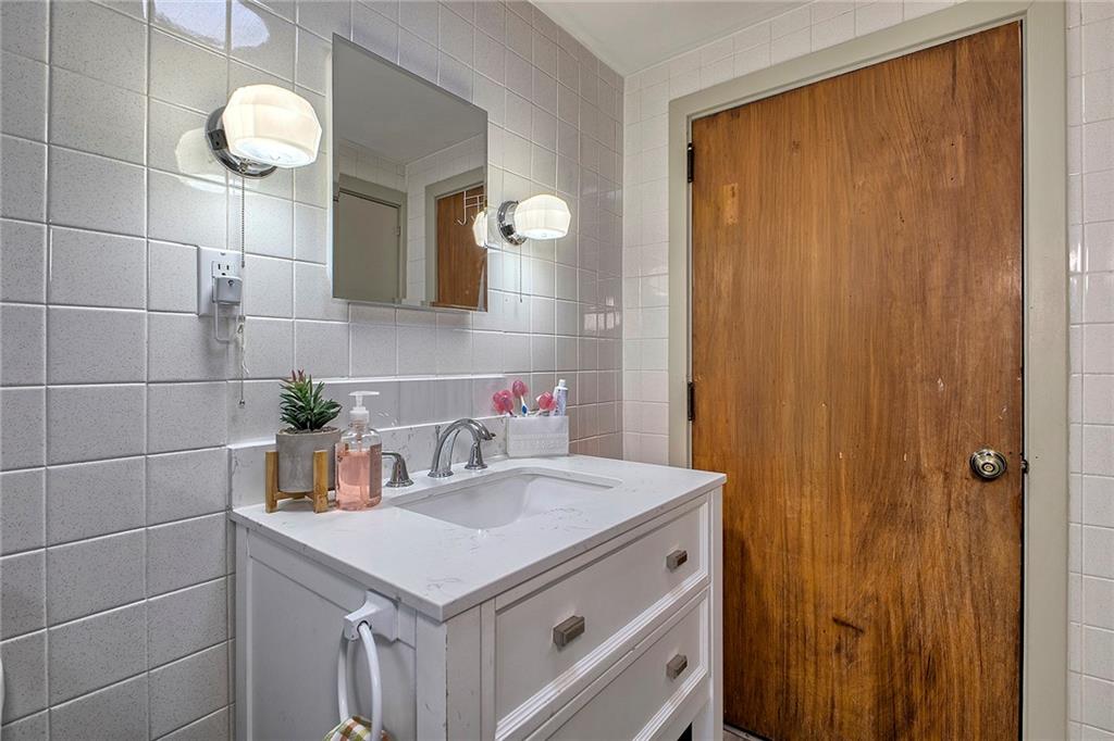 155 Lenox Street Uniontown, PA 15401 - Photo 25 of 32 a bathroom with a sink vanity and a mirror