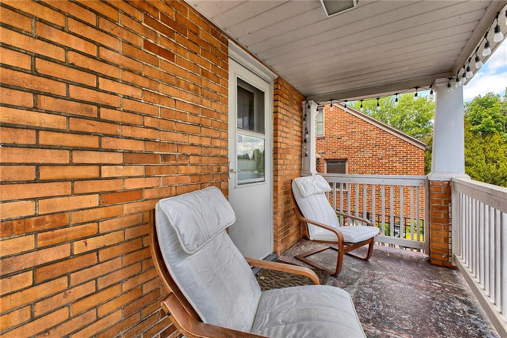 155 Lenox Street Uniontown, PA 15401 - Photo 3 of 32 a view of a chair in wooden deck