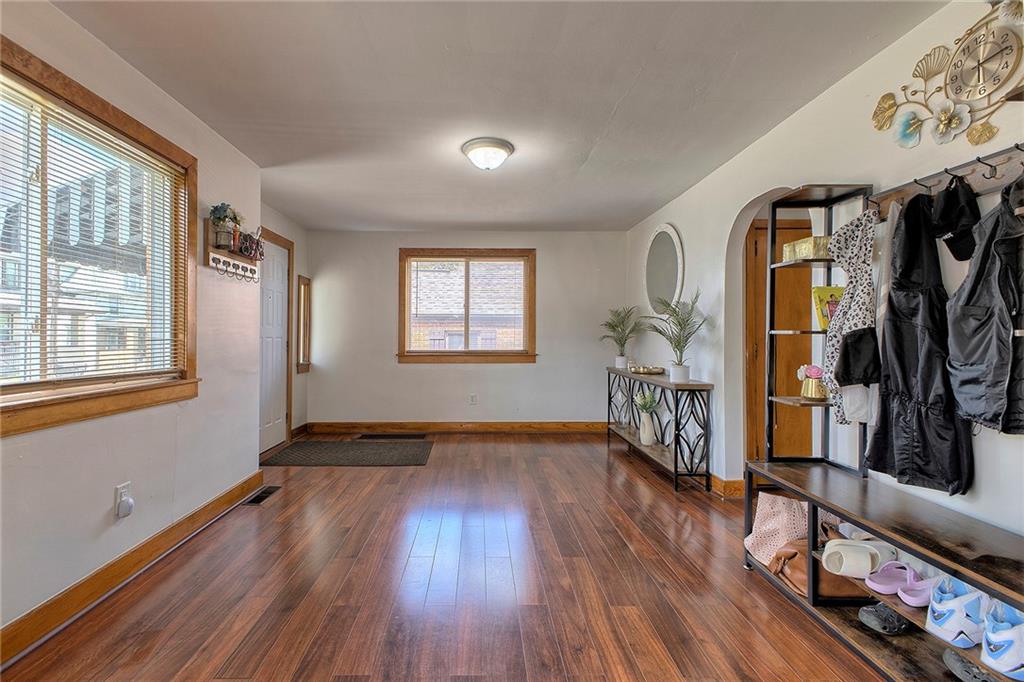 155 Lenox Street Uniontown, PA 15401 - Photo 5 of 32 a view of empty room with wooden floor and fan