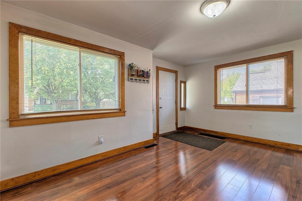 155 Lenox Street Uniontown, PA 15401 - Photo 7 of 32 a view of an empty room with wooden floor and a window