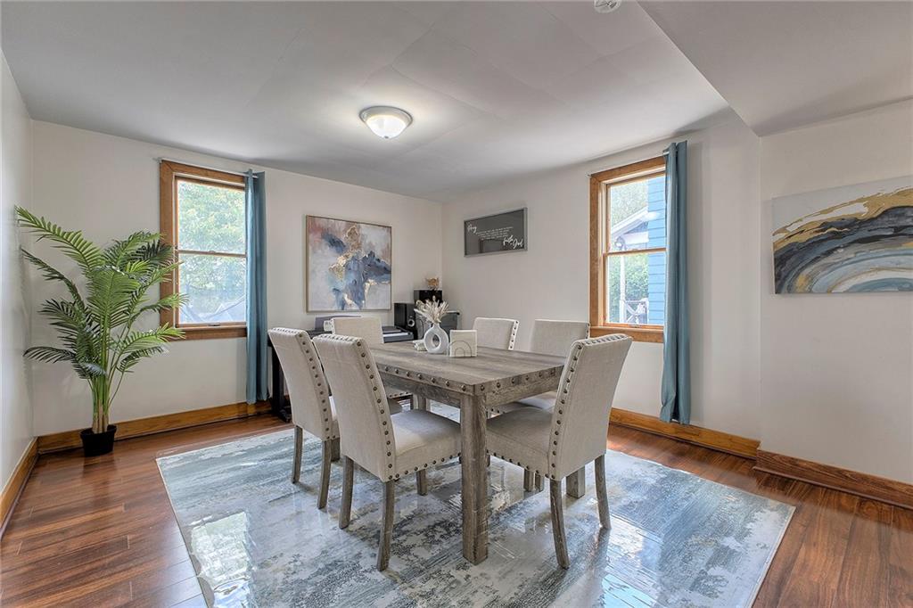 155 Lenox Street Uniontown, PA 15401 - Photo 8 of 32 a view of a dining room with furniture window and wooden floor