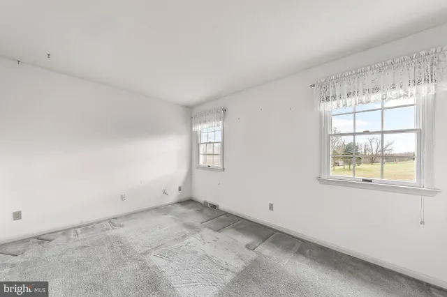 an empty room with windows