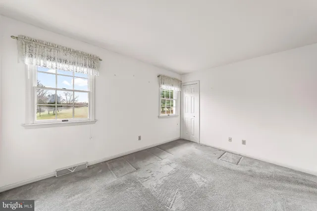 an empty room with windows