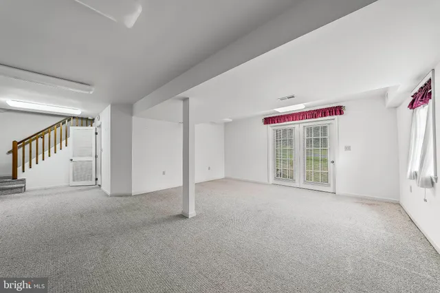 a view of an empty room with a fireplace