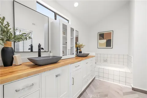 a bathroom with a shower a toilet and a sink