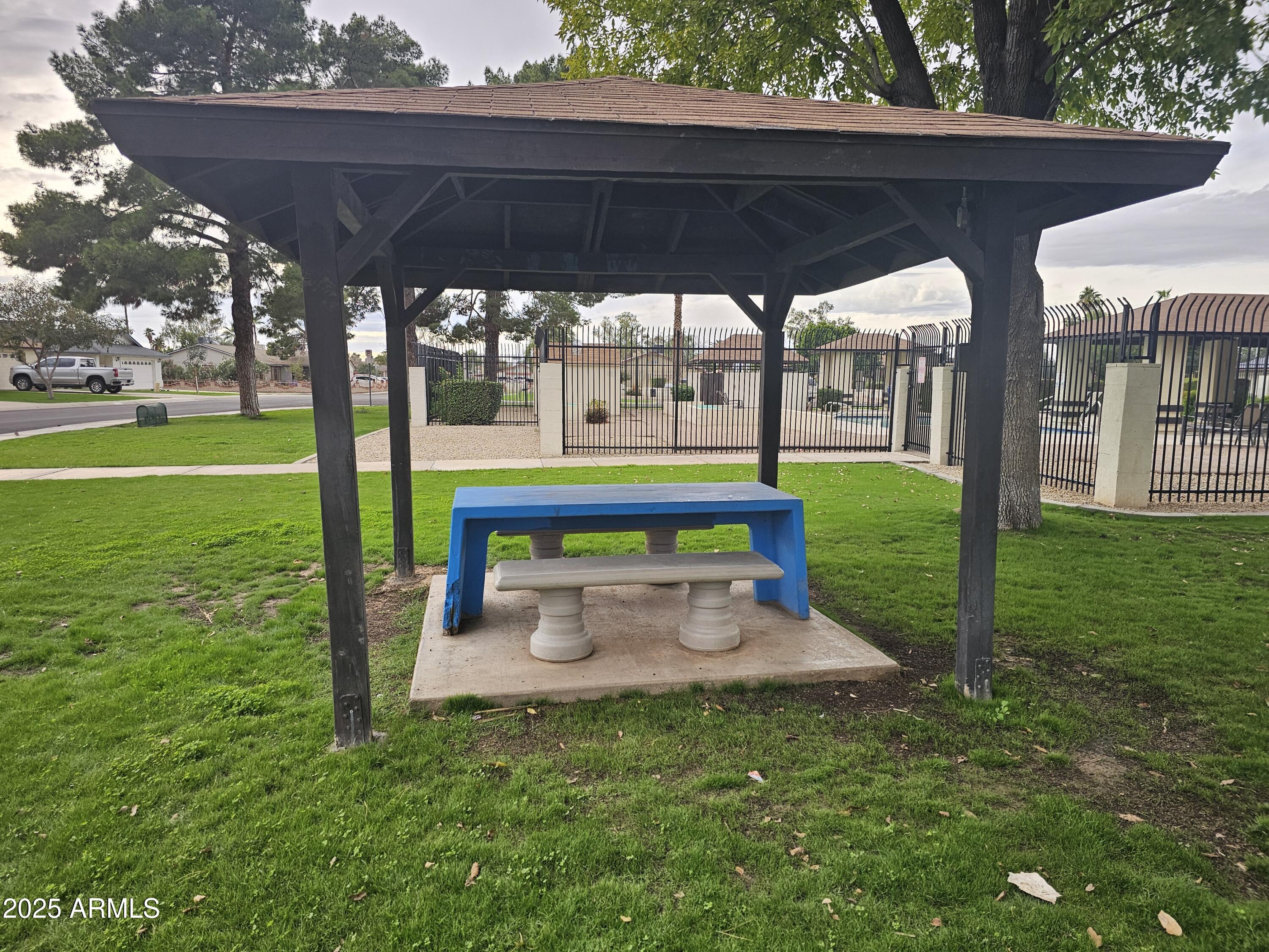 10032 West Sells Drive Phoenix, AZ 85037 - Photo 16 of 19 a bench sitting in the middle of a park