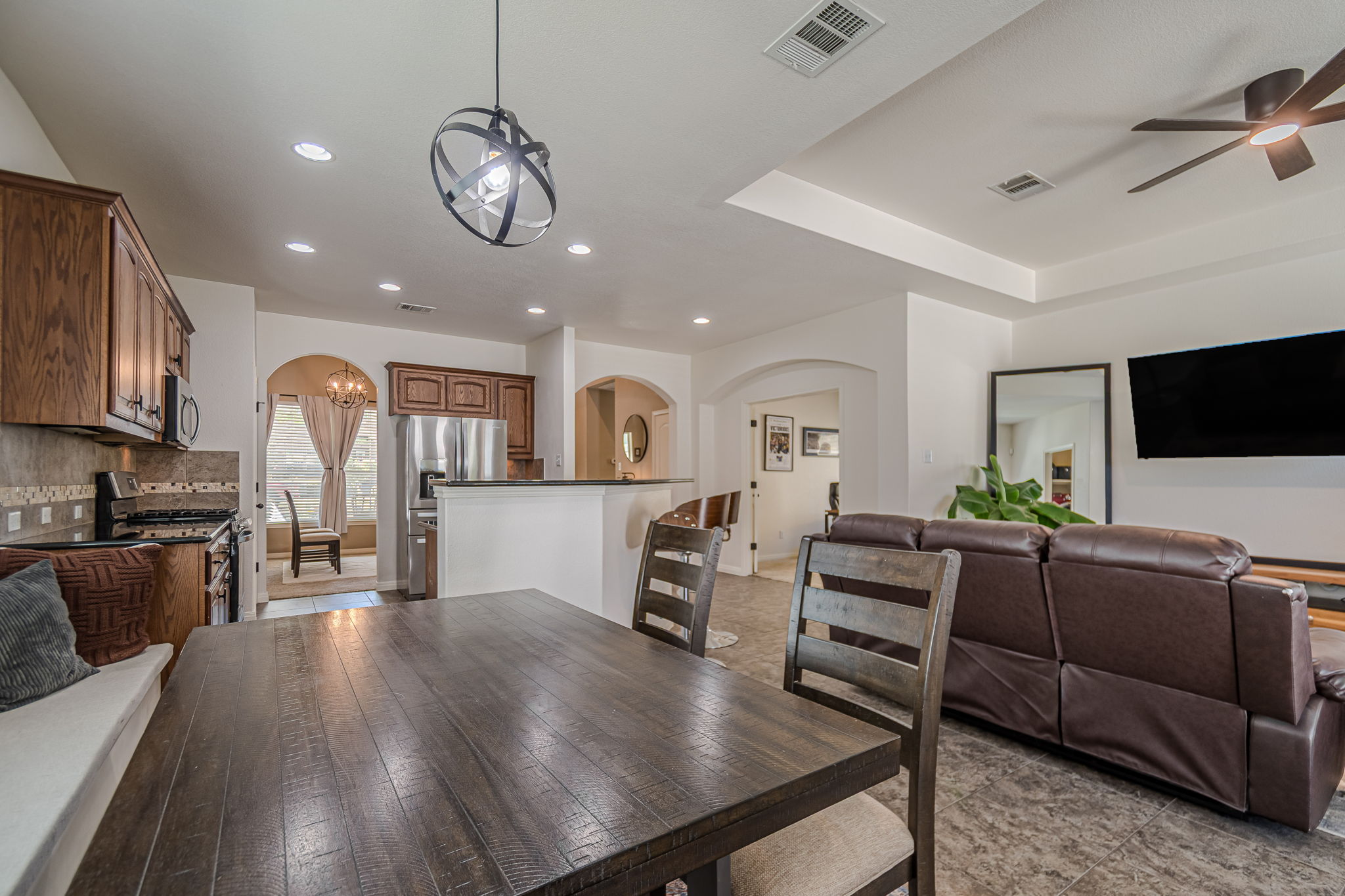 1031 Powell Kyle, TX 78640 - Photo 11 of 40 Dining space with a ceiling fan, and recessed lighting looking into the living room, kitchen and entry way