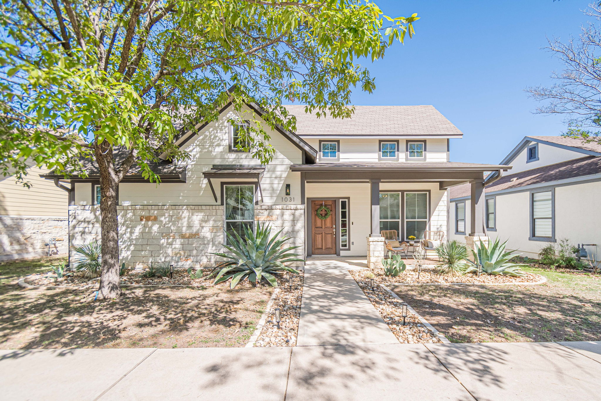 1031 Powell Kyle, TX 78640 - Photo 2 of 40 View of front of house with a covered porch and stone siding