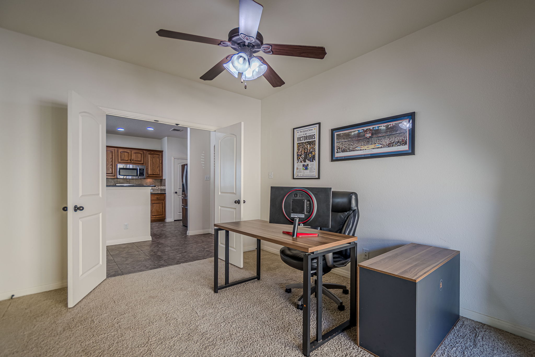 1031 Powell Kyle, TX 78640 - Photo 22 of 40 Looking into the kitchen from bedroom/office