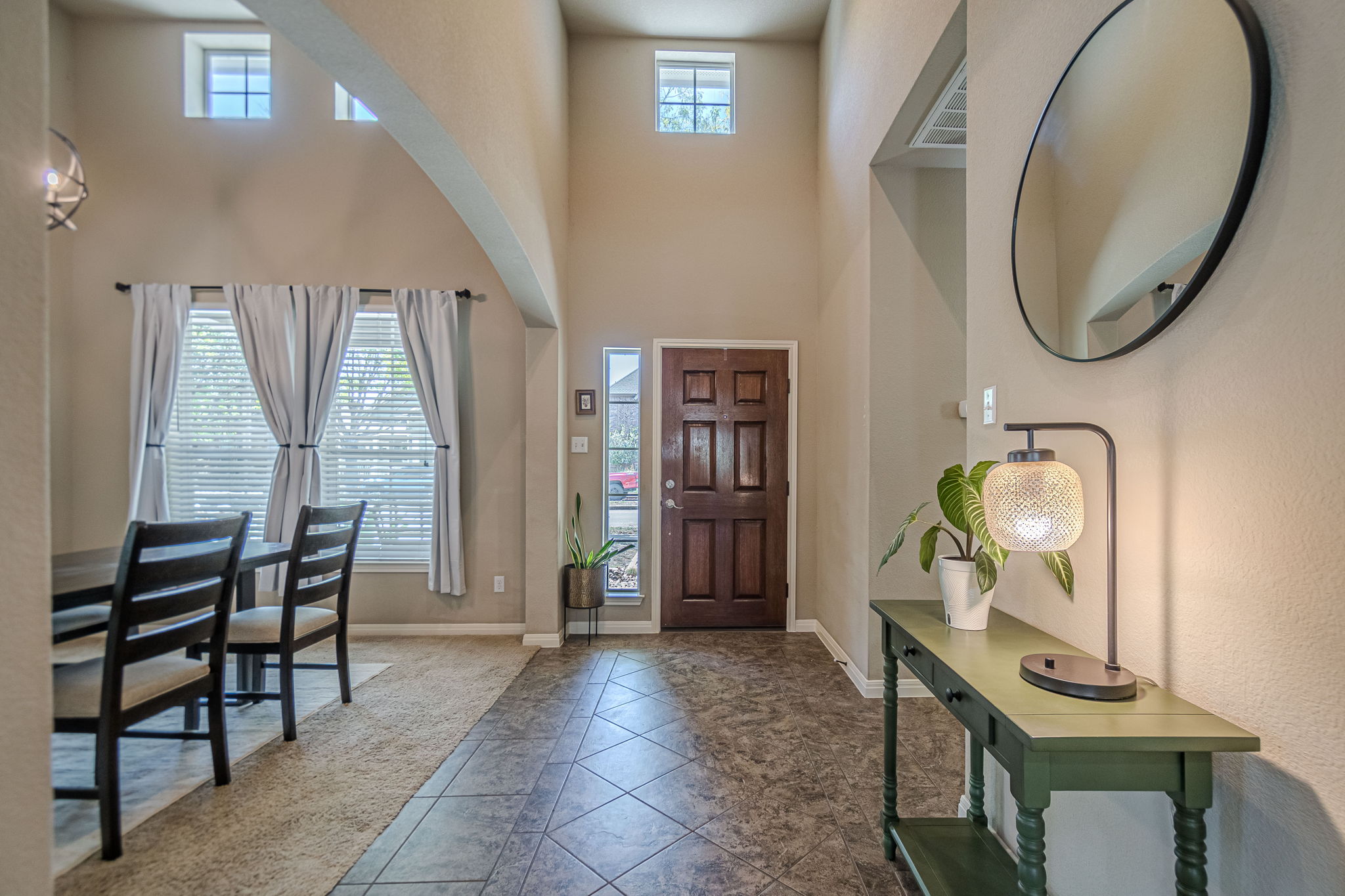 1031 Powell Kyle, TX 78640 - Photo 3 of 40 Tiled entryway featuring baseboards and a high ceiling