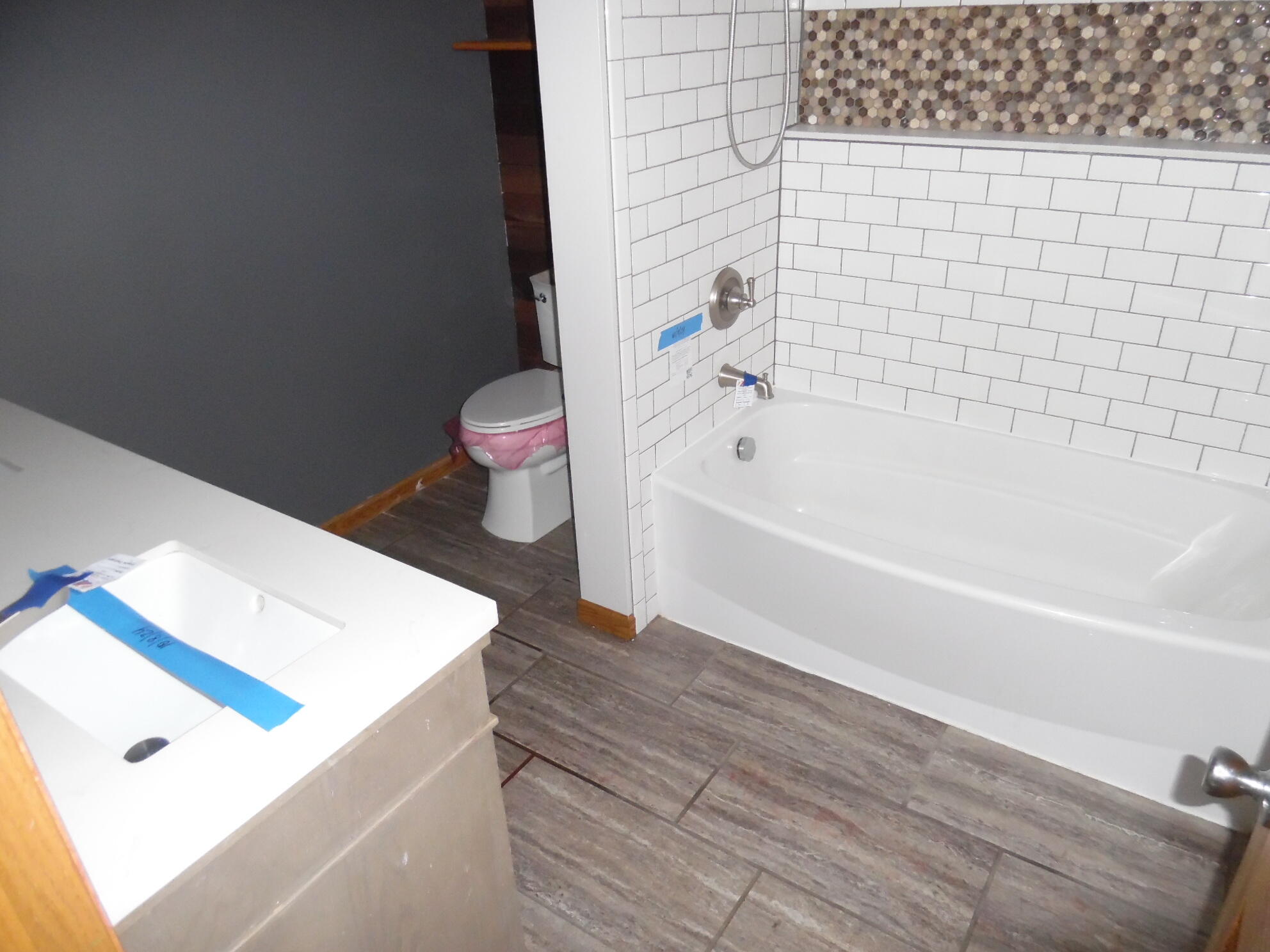 813 West Division Road De Motte, IN 46310 - Photo 14 of 20 a bathroom with a bathtub and a toilet