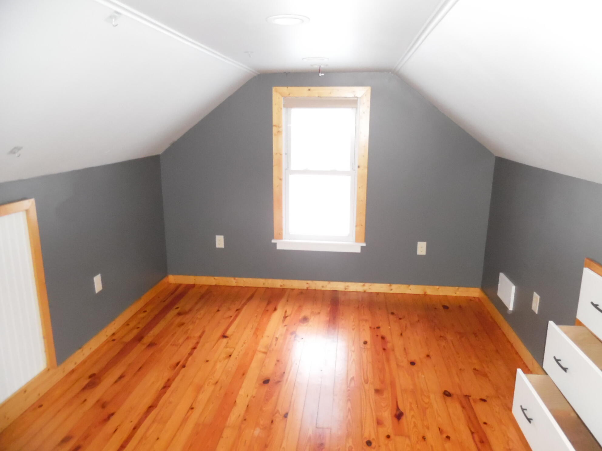 813 West Division Road De Motte, IN 46310 - Photo 17 of 20 a view of an empty room with wooden floor and a window